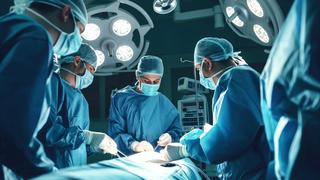 Medical staff working on a burn injury victim in the operating room that symbolizes this burn injury lawyer webpage.