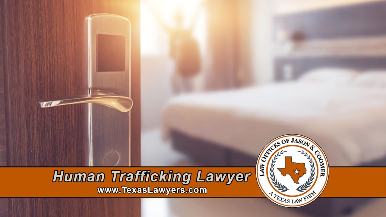 A person sits alone in a dim hotel hallway, symbolizing the isolation and fear that human trafficking survivors in Texas often experience before reaching out for help.